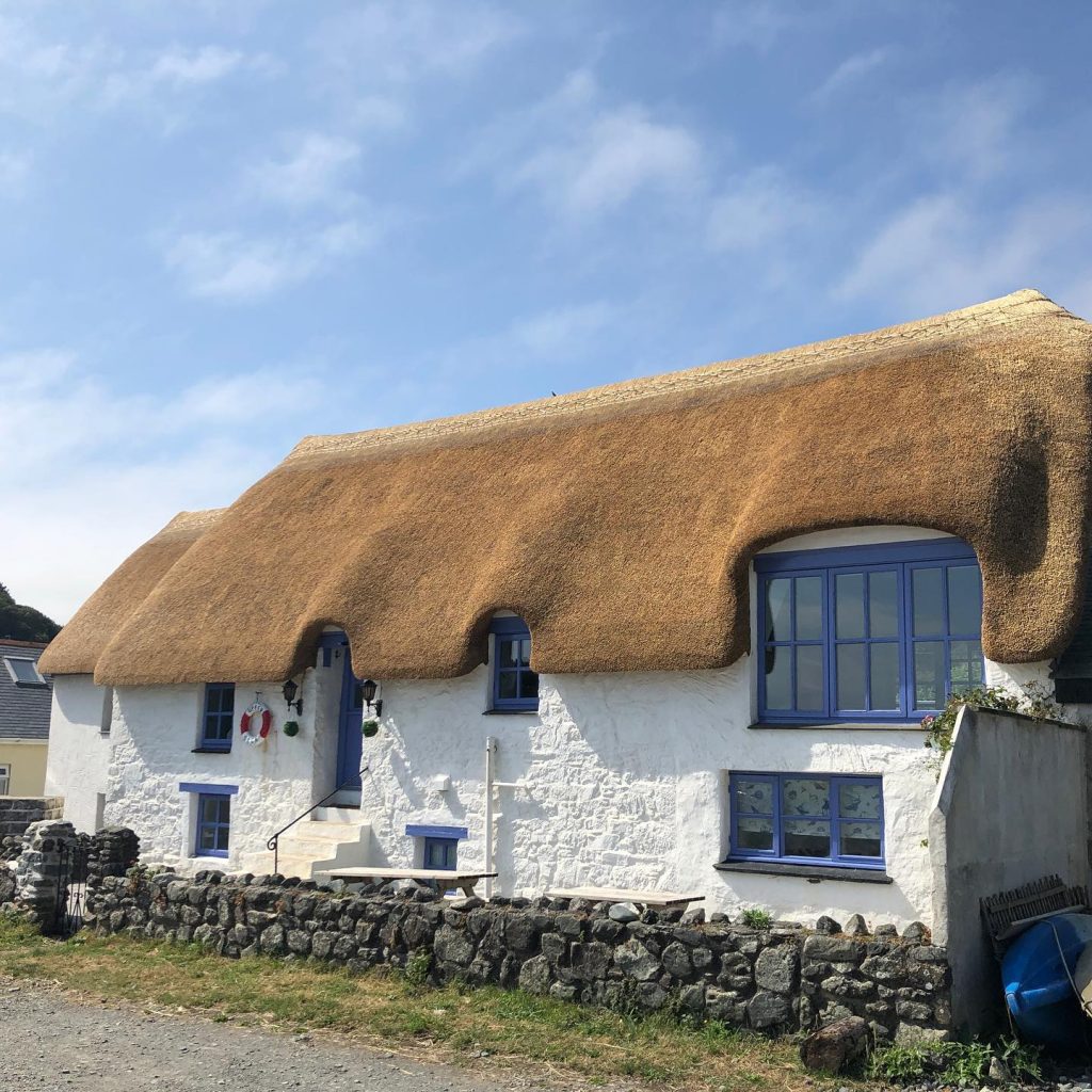Traditional cottage with freshly completed thatched roof